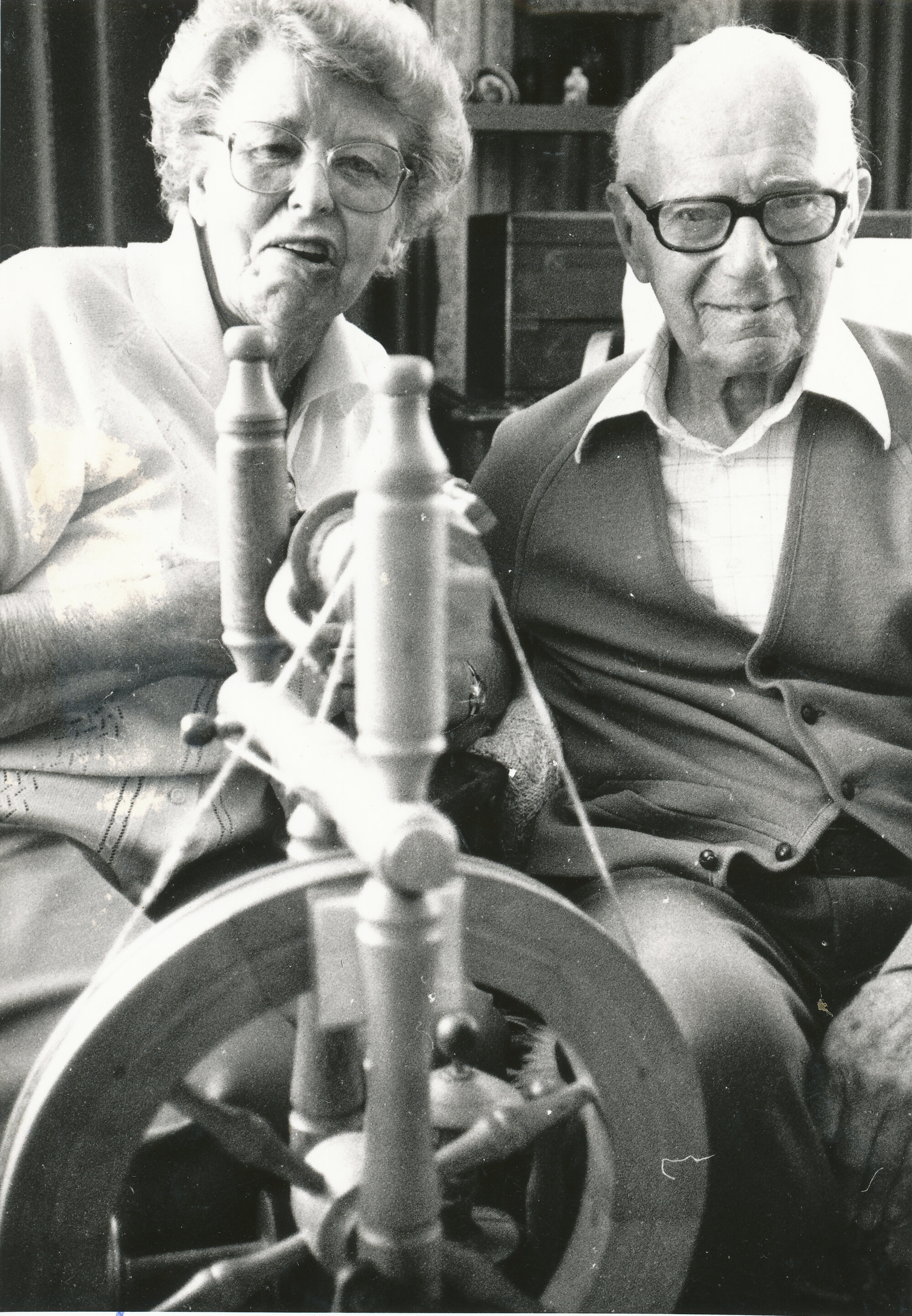 Pauline and Norman Gould, recently retired from the Spinners and Weavers Club, with spinning wheel made by Norman.