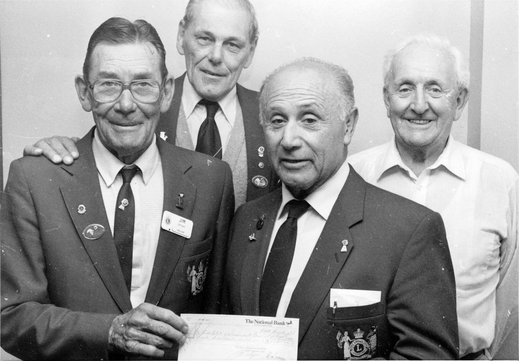 Lions; Wainuiomata Pakeke's Jim Brown and Arthur Martin receive $500 from Upper Hutt's George Solomon and John Pollock.