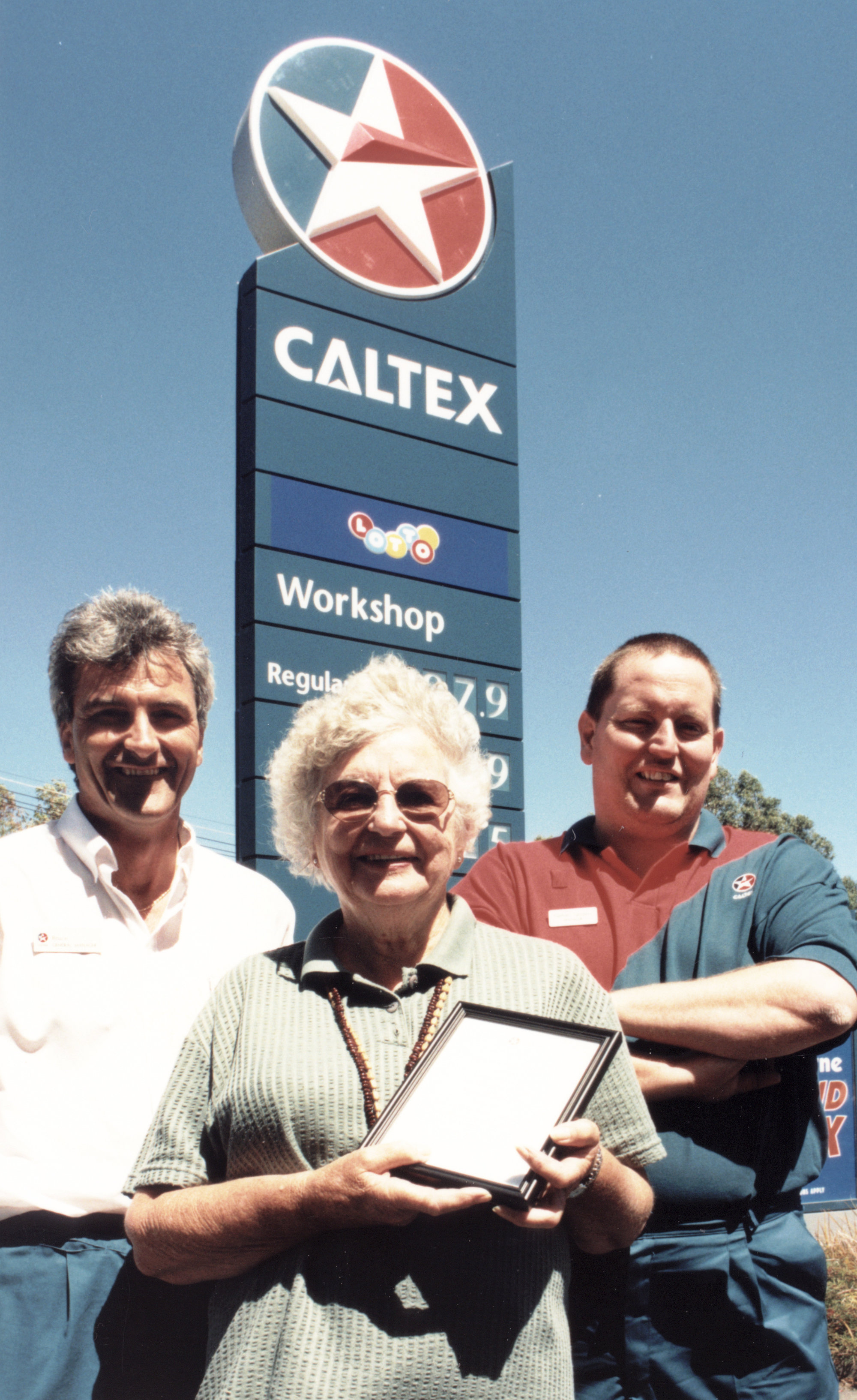Unsung hero, 2000; Mary Richardson, with Caltex managers Bruce Ridley, Rimutaka, and Nathan Saunders, Trentham.