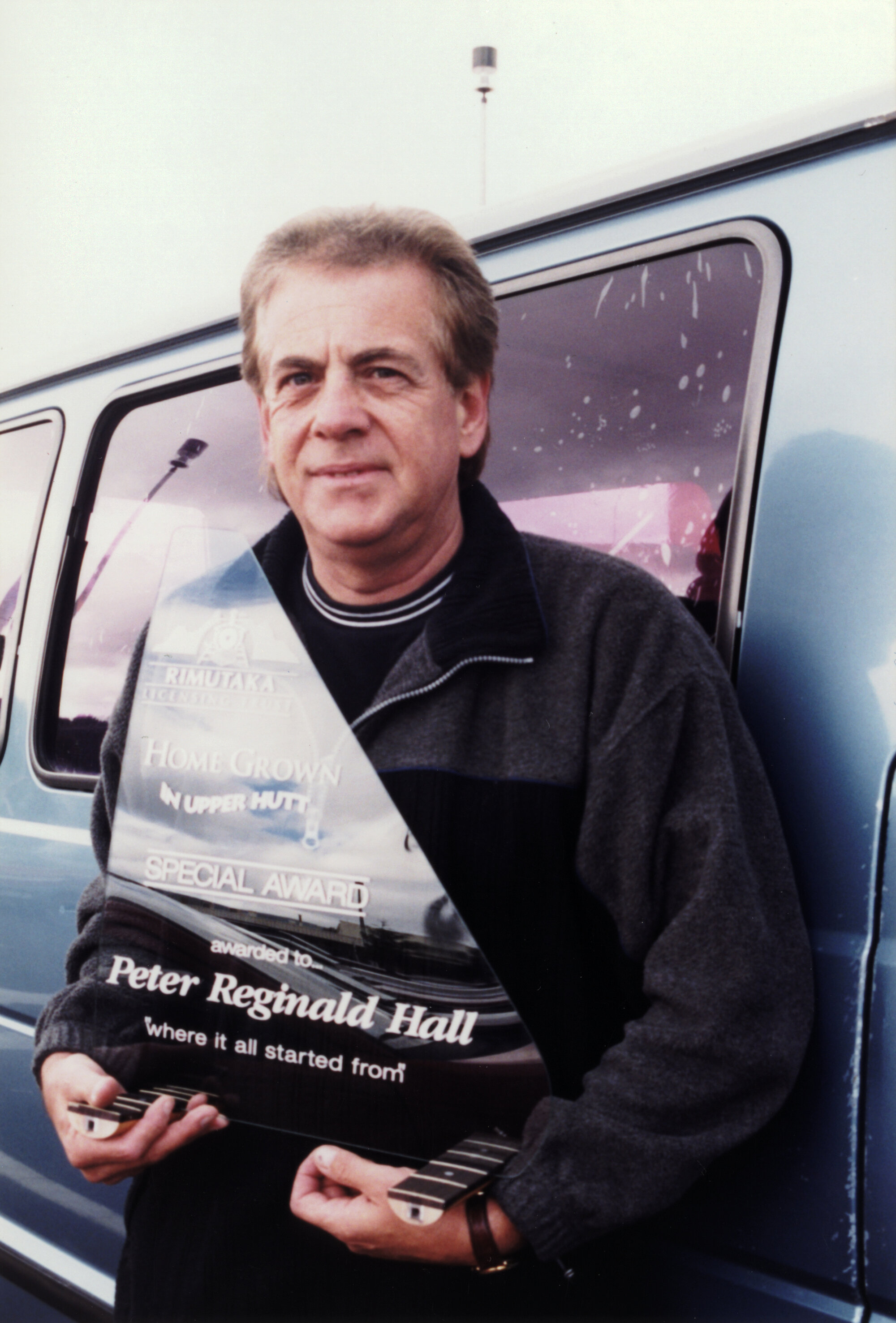 Millennium; "Home Grown in Upper Hutt" CD; Peter Hall with award made from broken window which started the project.