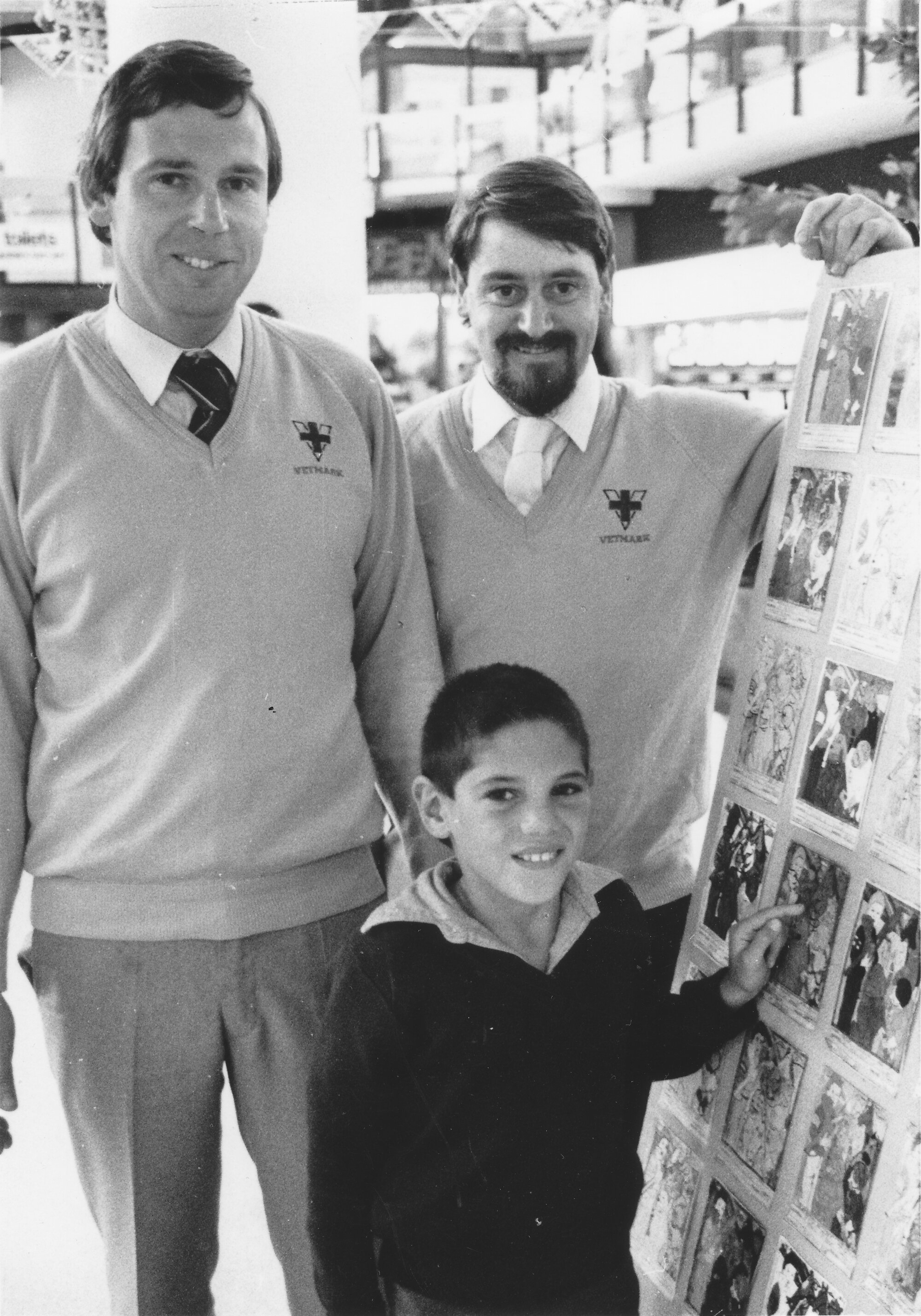 Vetmark colouring competition winner Jared Eynon with veterinarians Ray Lord and Peter Miller.