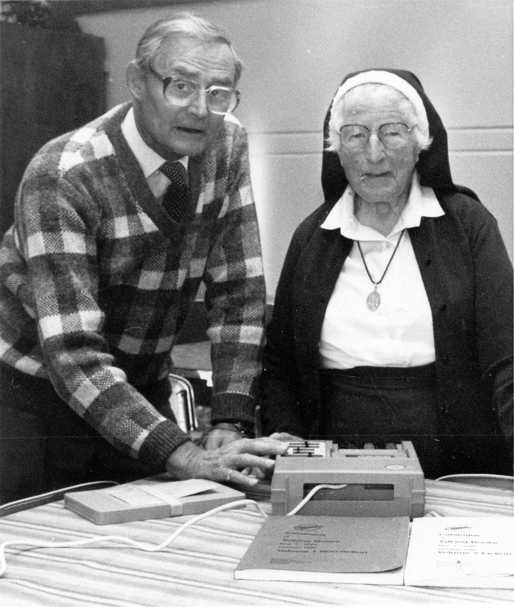 Home of Compassion;  Blind Foundation's Peter Nash explains a 'talking book' to Sister Eustace.