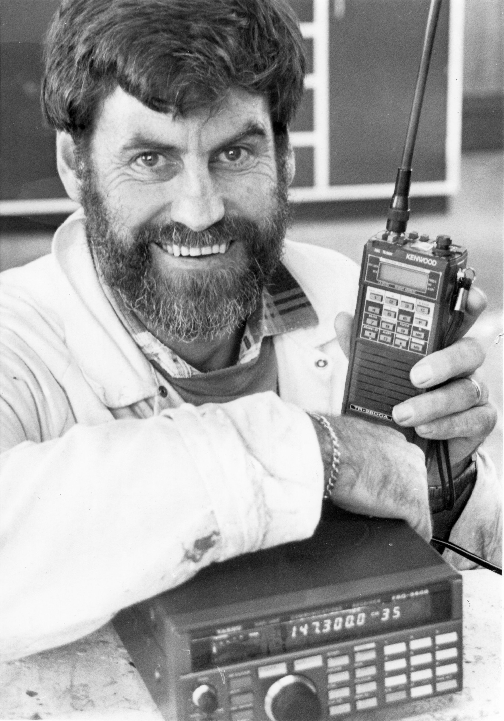 John MacDonald with hand-held and desk-top transmitter/receivers.