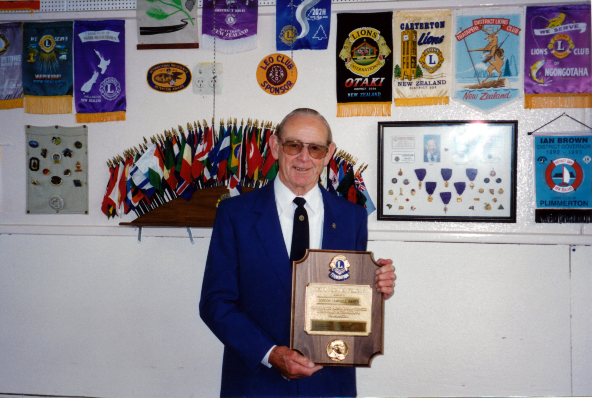 Lions; Silverstream's charter president, Gordon Raikes, with Melvin Jones Felowship Award.