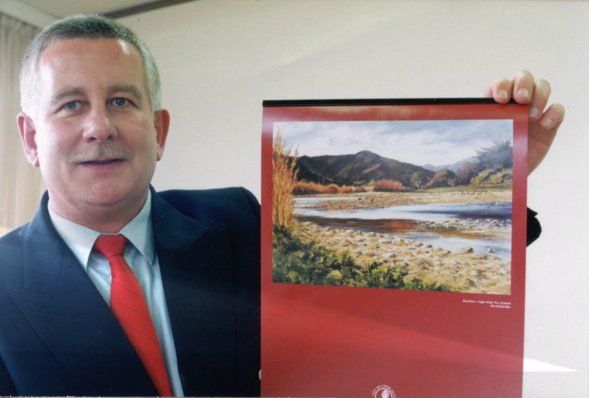 City promotion manager Bruce Page with promotional calendar