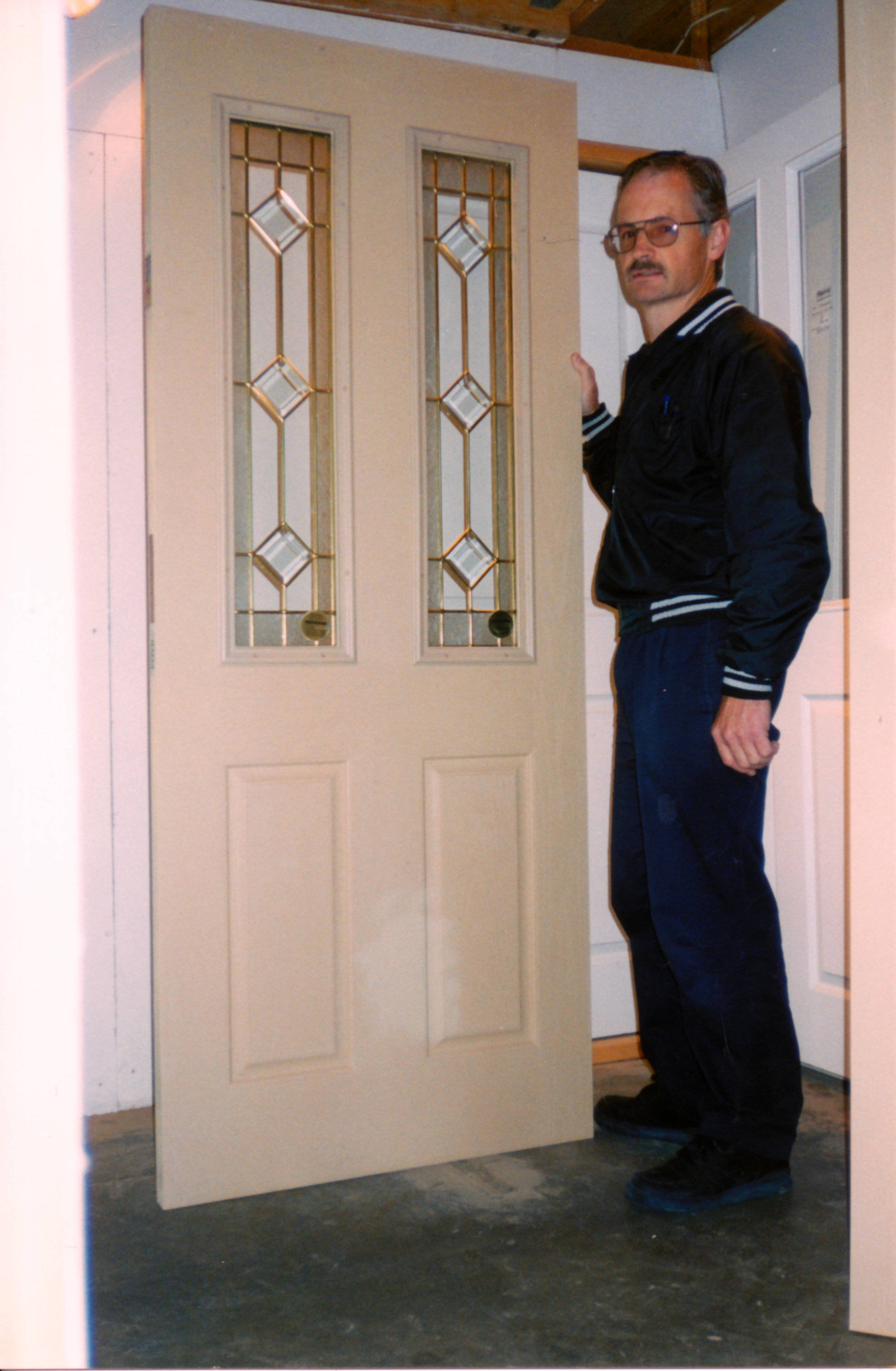 Upper Hutt Doors and Mouldings, 6 Goodshed Road; Paul Keating with fibreglass door.