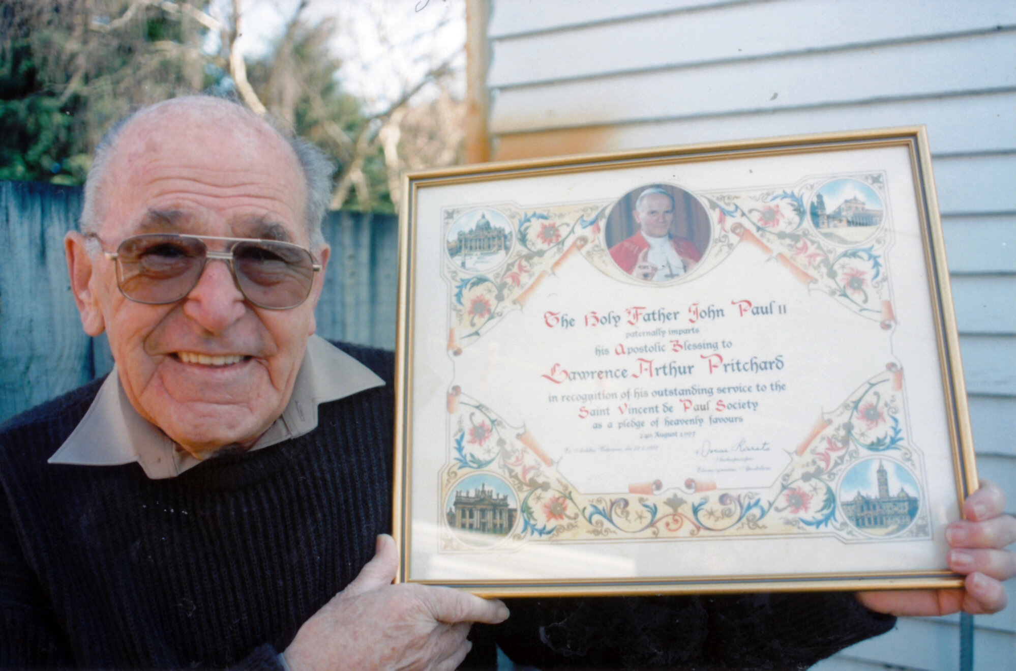 Larry Pritchard receives papal blessing for work with Saint Vincent de Paul Society.