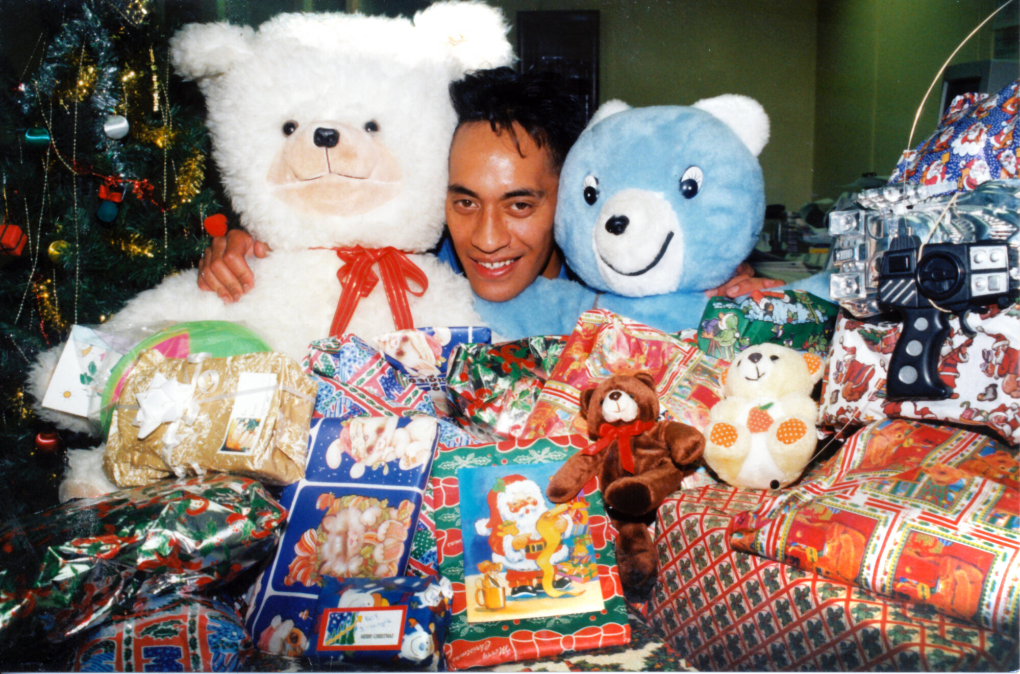 Upper Hutt Leader staff; Mathew Tomokino with toys from annual appeal.
