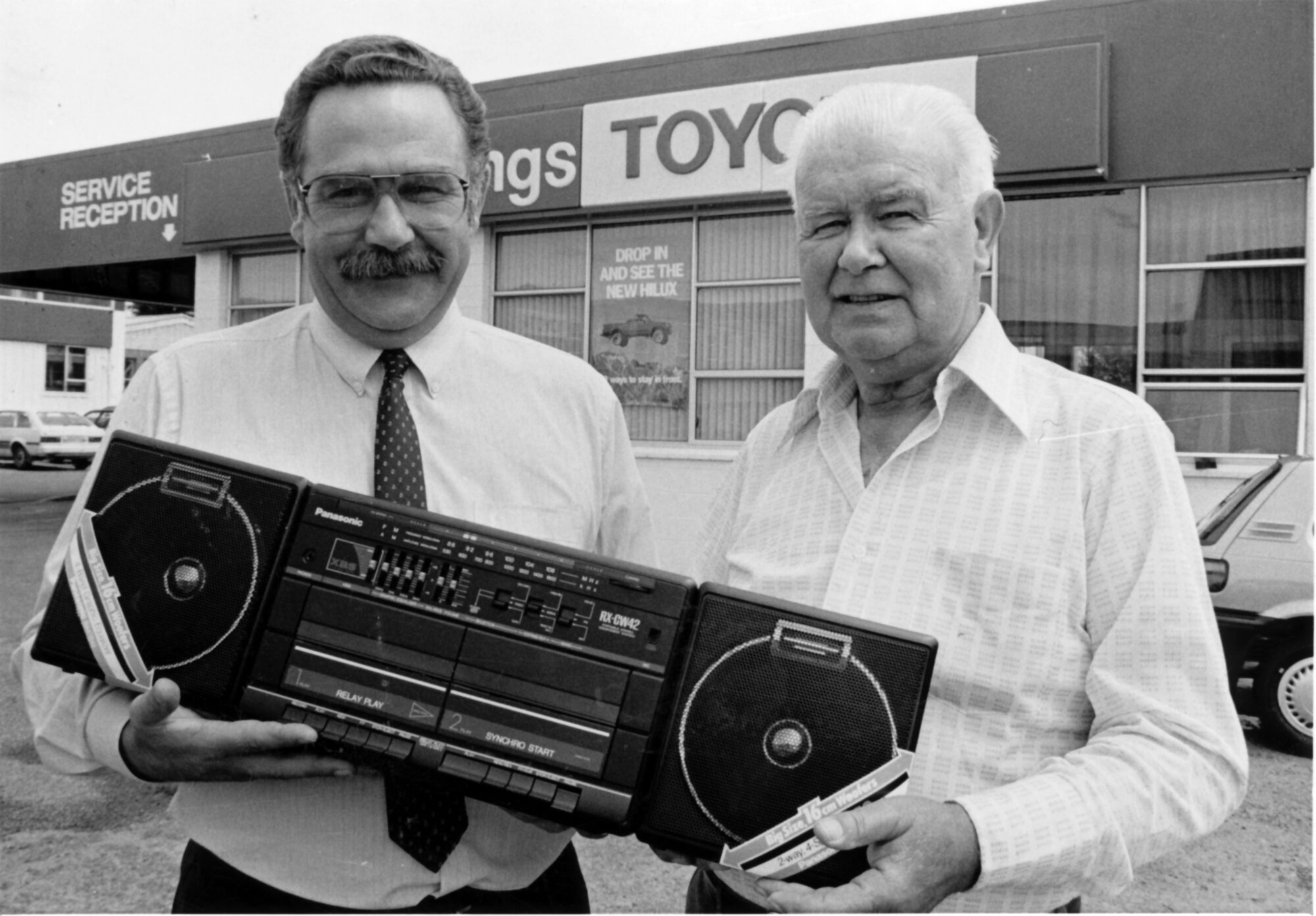 Woodings Toyota; Mike Woodhead and summer draw winner Mr D F Ross.