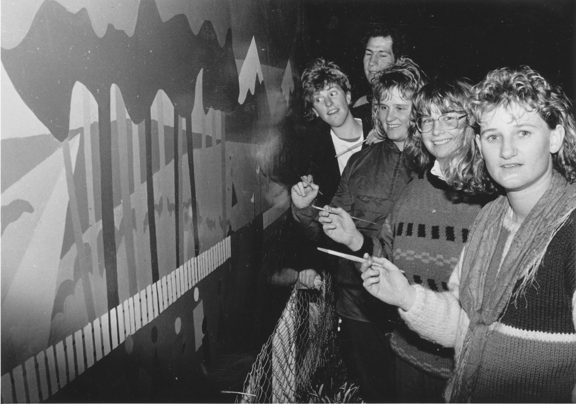 Central Institute of Technology; occupational-therapy students painting a fence mural at a Seddon Street playcentre.
