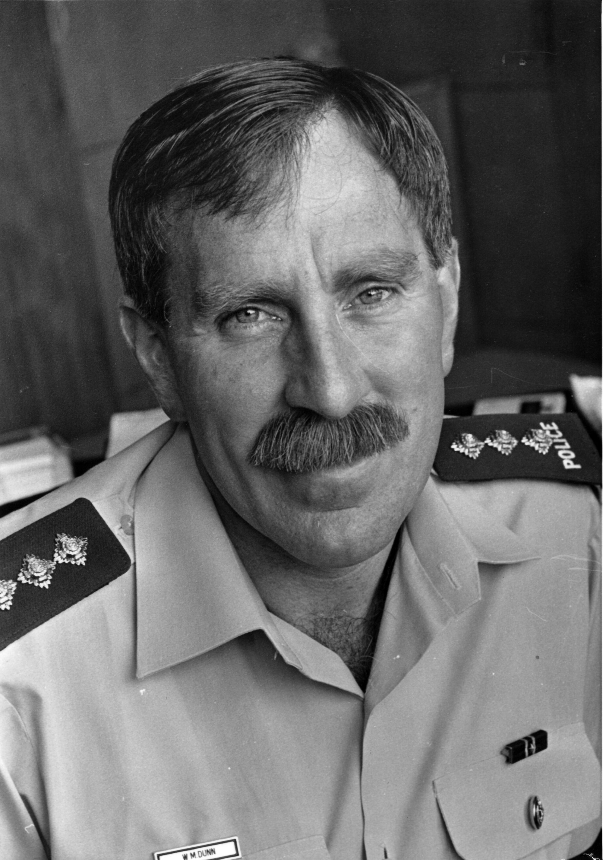 Police Inspector Bill Dunn; area commander.