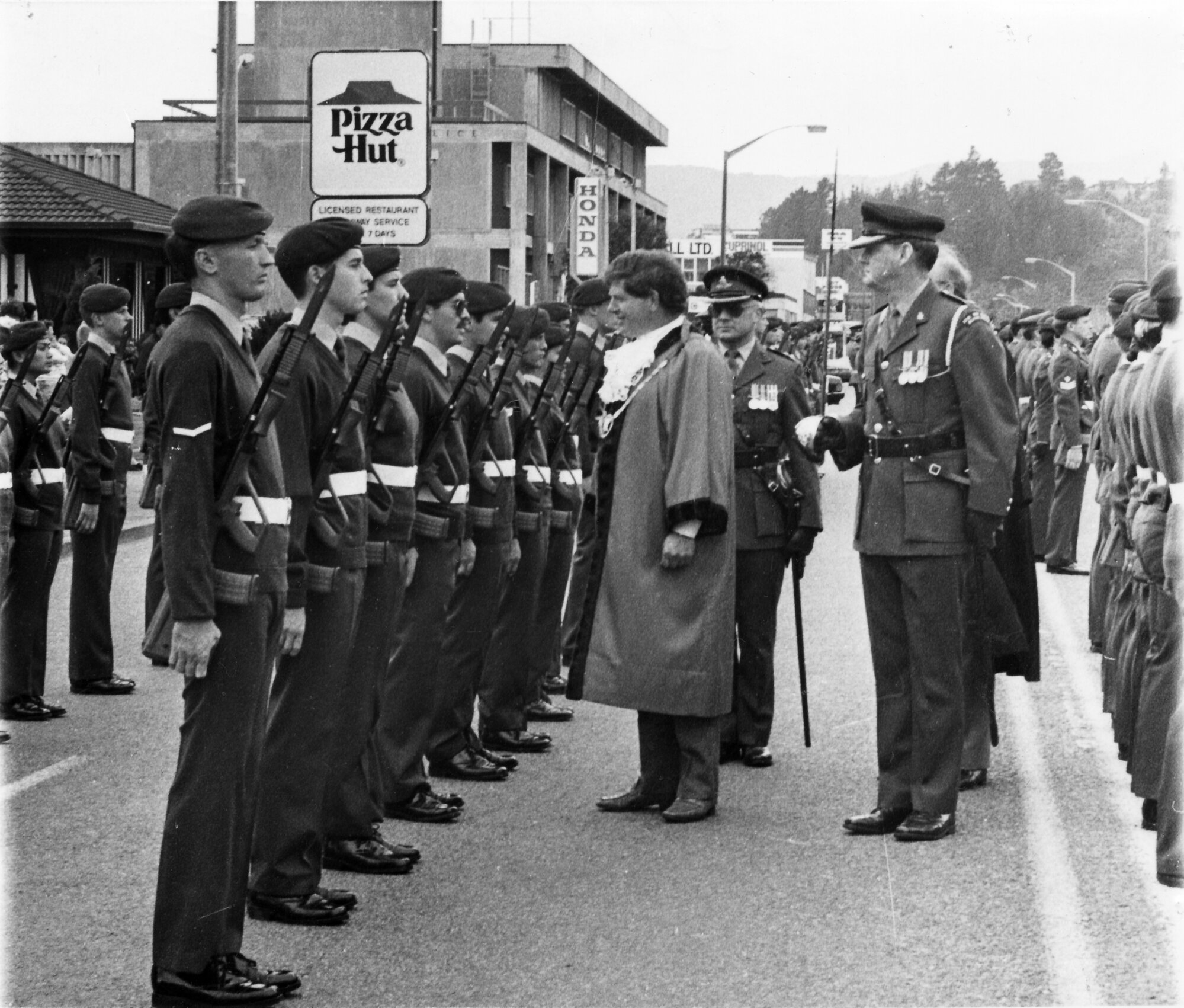 Army charter parade; mayor Rex Kirton reviews troops.