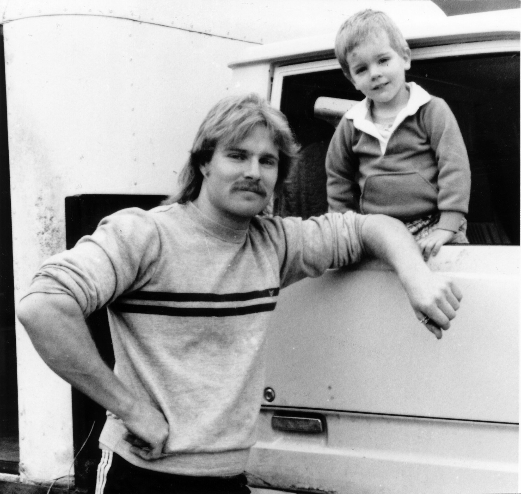 Warren Poston with son John, 2; milk- and 'Leader'-delivery man; Maoribank, Akatarawa, Parkdale.