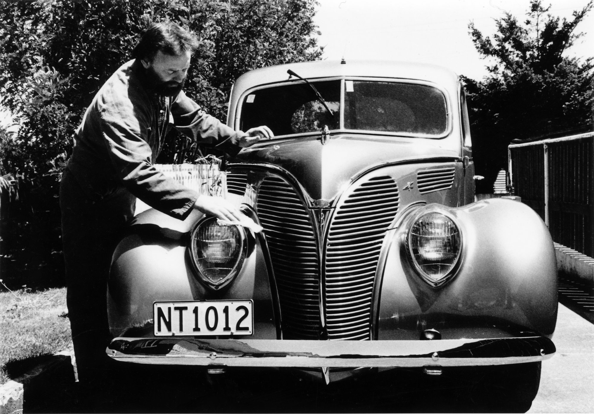 Trevor Burton and his restored 1938 Ford Deluxe Coupe. 