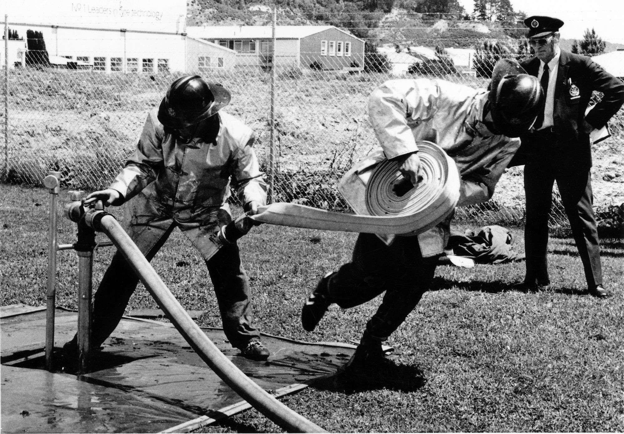 Fire brigades; annual motor industrial competition; General Motors A team changing hoses.