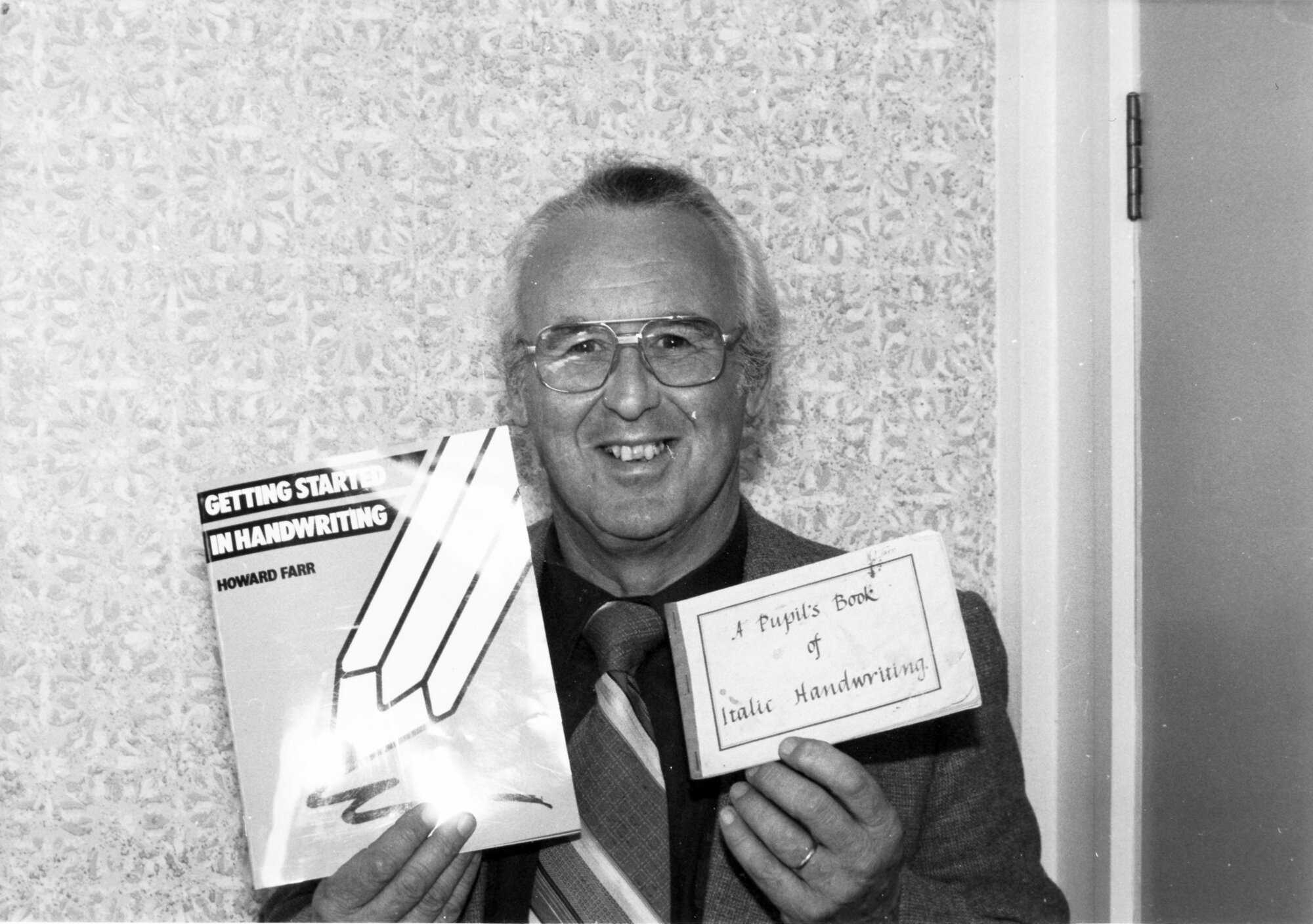 Upper Hutt Primary School principal Howard Farr wth new book 'Getting Started in Handwriting' and earlier one on italic handwriting.
