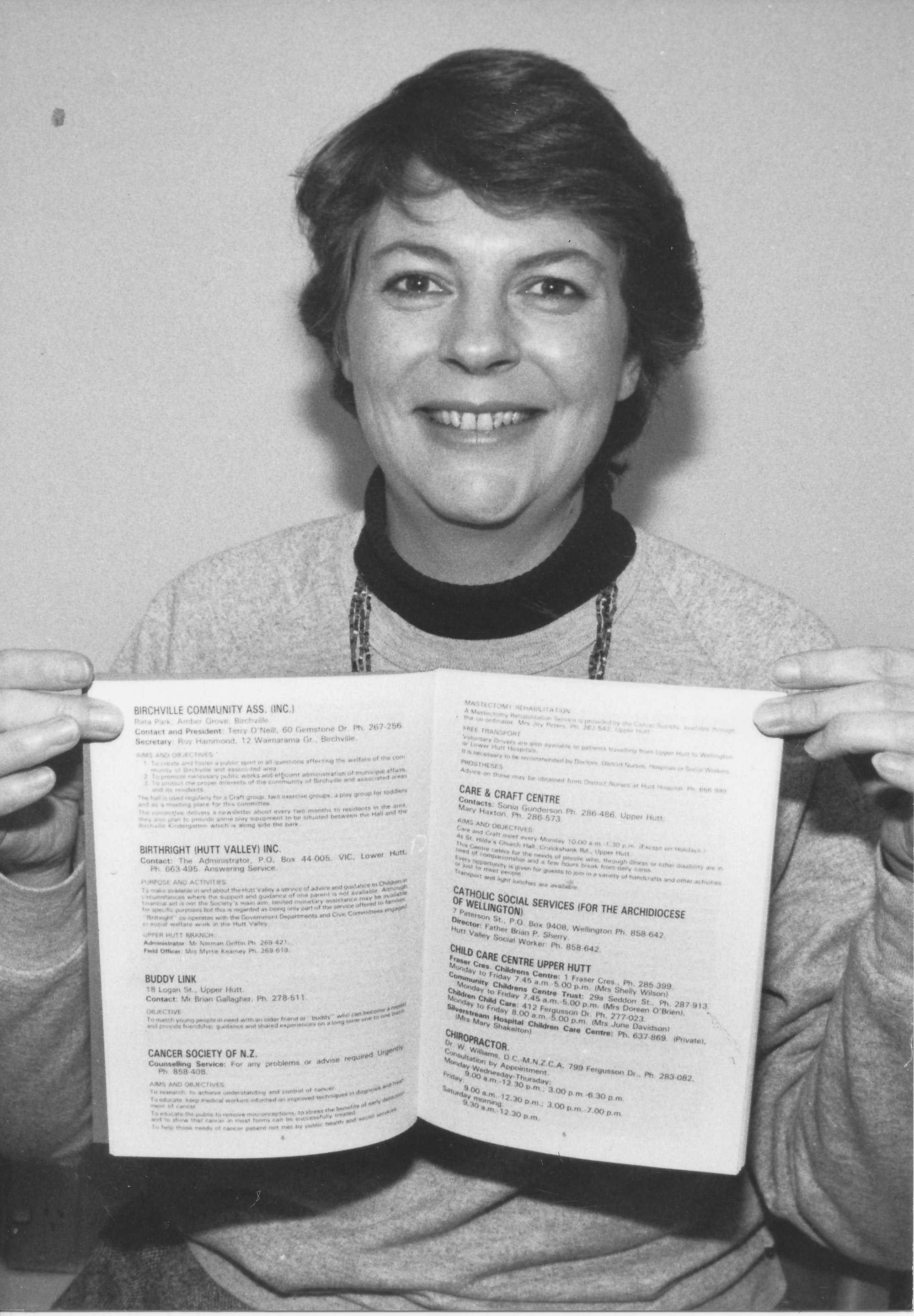 Council  of social services chairman Ingrid Thomas with new printed social-services directory, covering over 200 entries,