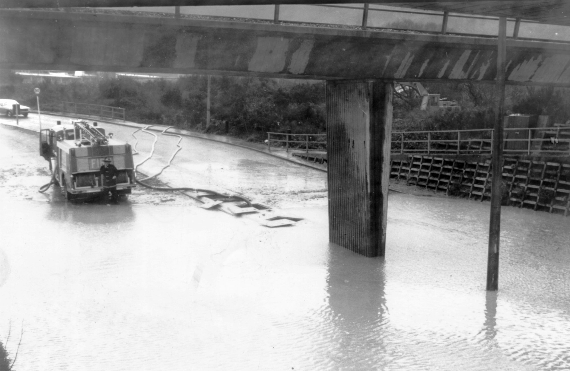 Flood, 1981; Silverstream Fire Brigade pumping out Dunn's Road railway underpass