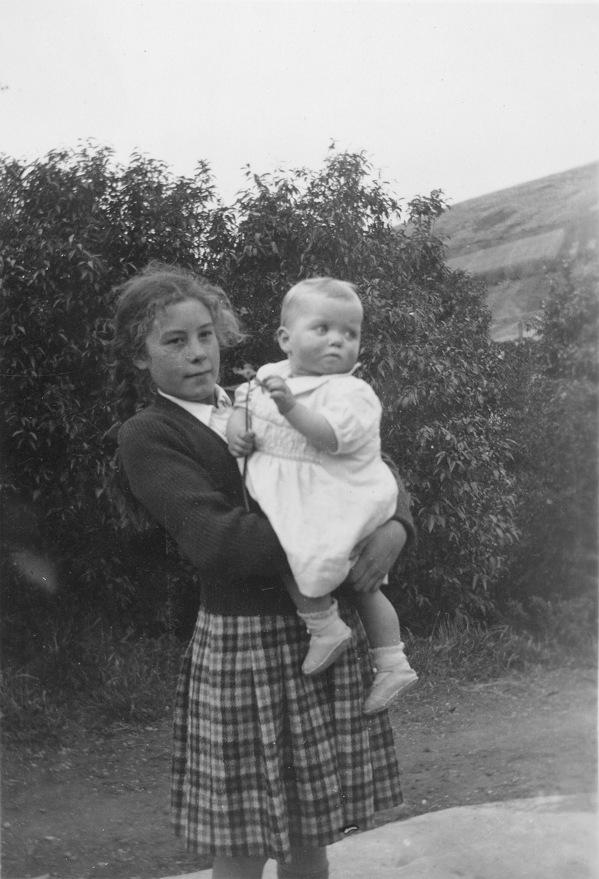 Teenage girl holding baby. [P1-73-891]