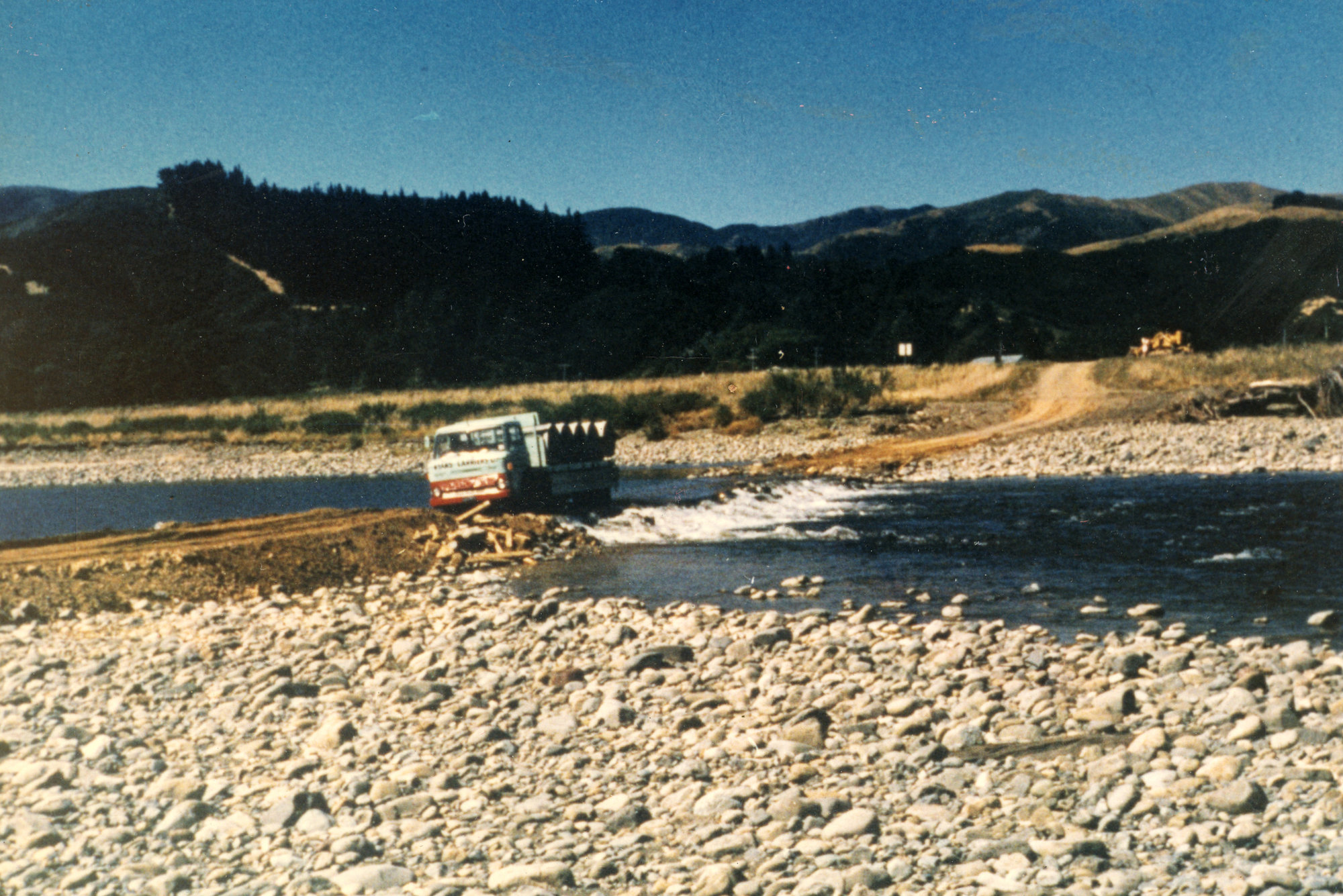 Totara Park; truck with concrete pipes.