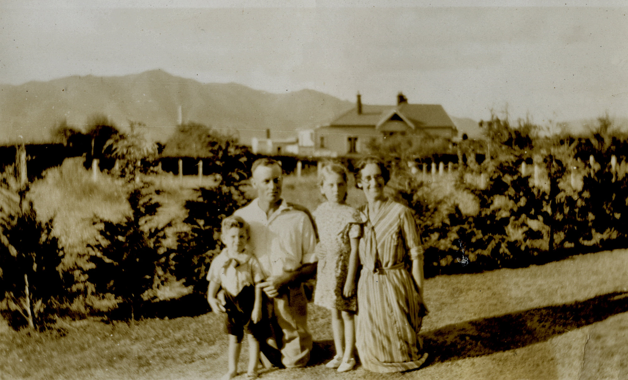 Poulson family; Hec and May, children Eda and Ben; back yard, 41 Queen Street.