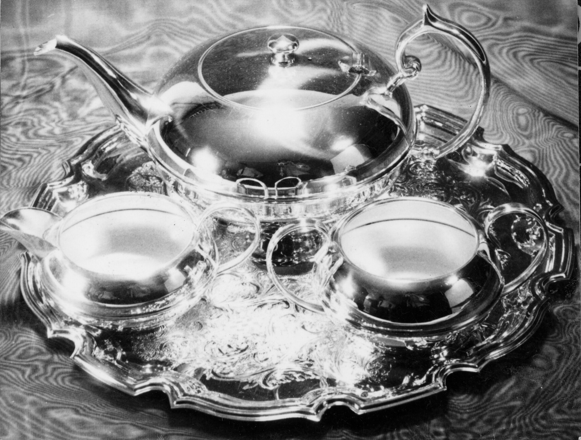 Hazelwoods sales pictures; silver-plated tea pot, milk jug, and sugar basin on tray.