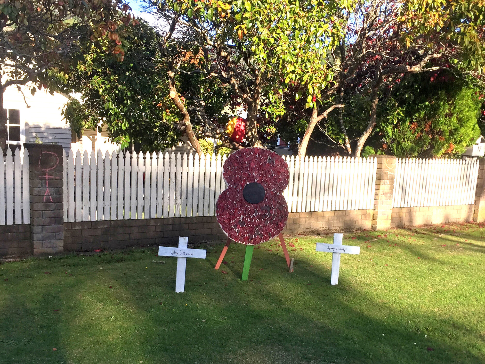 Poppy and crosses front lawn tribute, Pinehaven, Anzac Day 2020