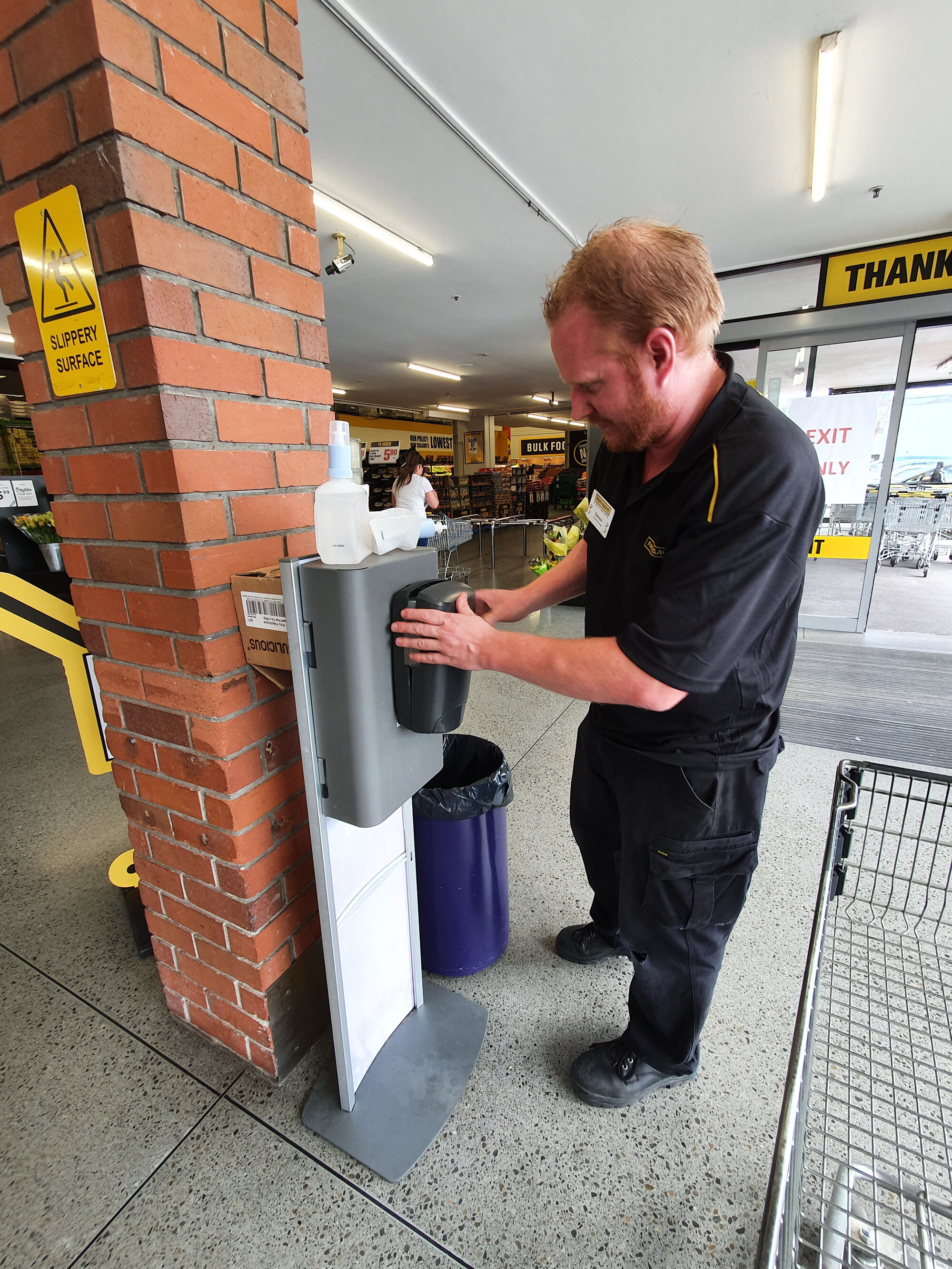 Sanitising hands at Pak'nSave