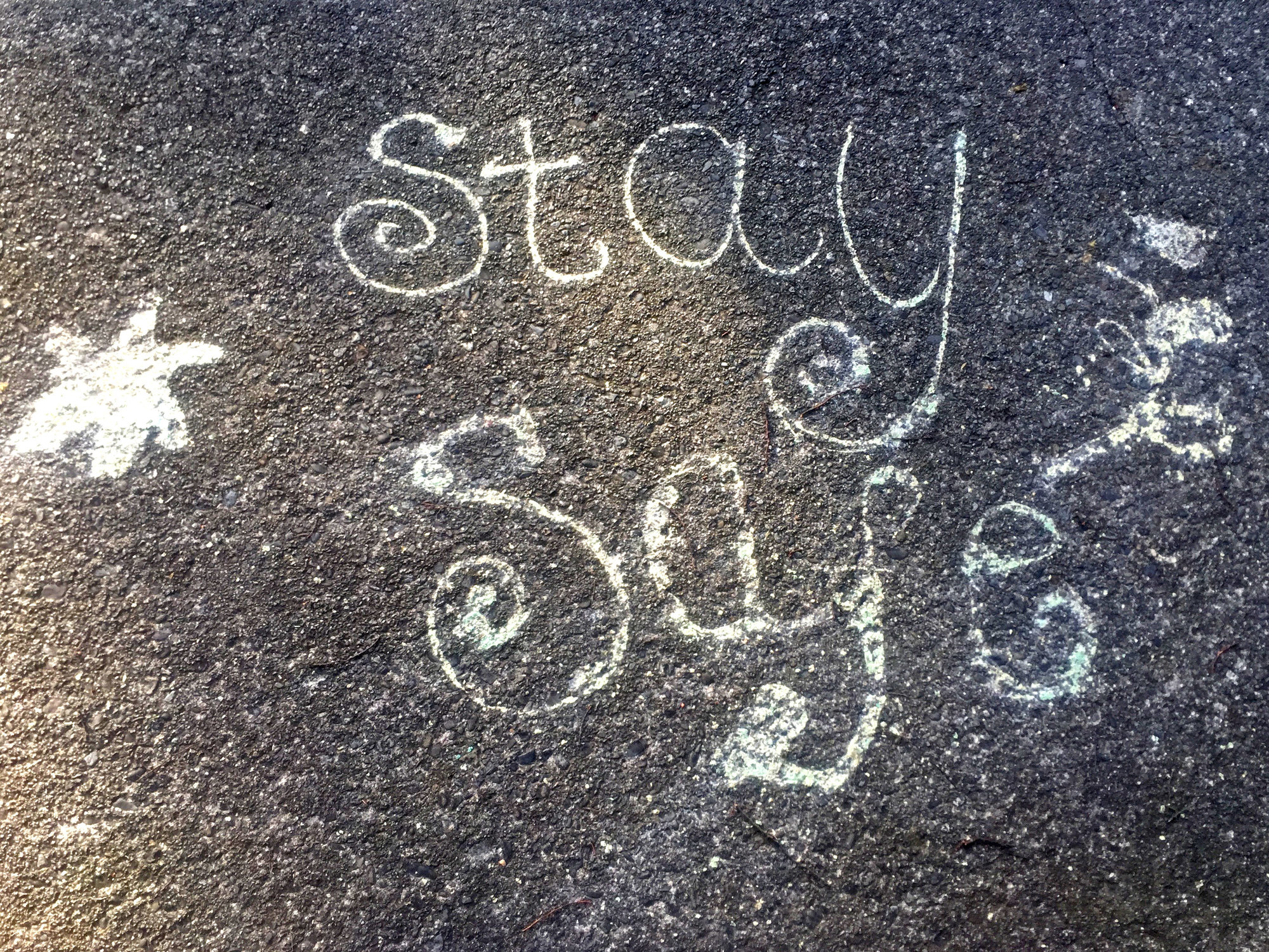 "Stay Safe" message painted on pavement, Pinehaven