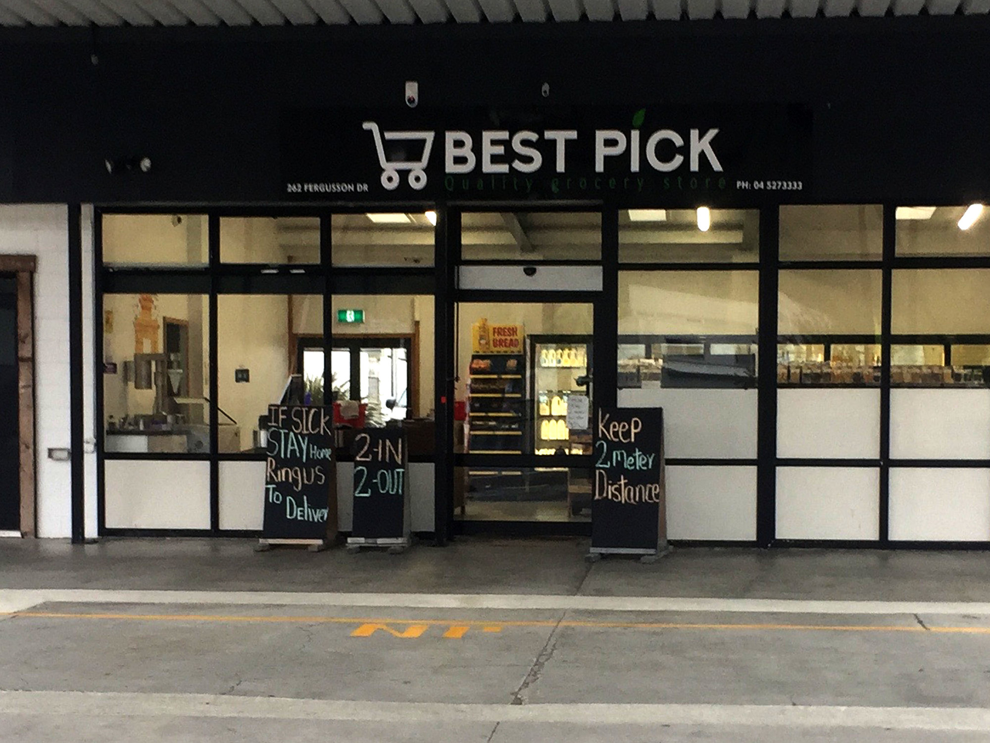 Covid-19 signs at Best Pick grocery store, Heretaunga