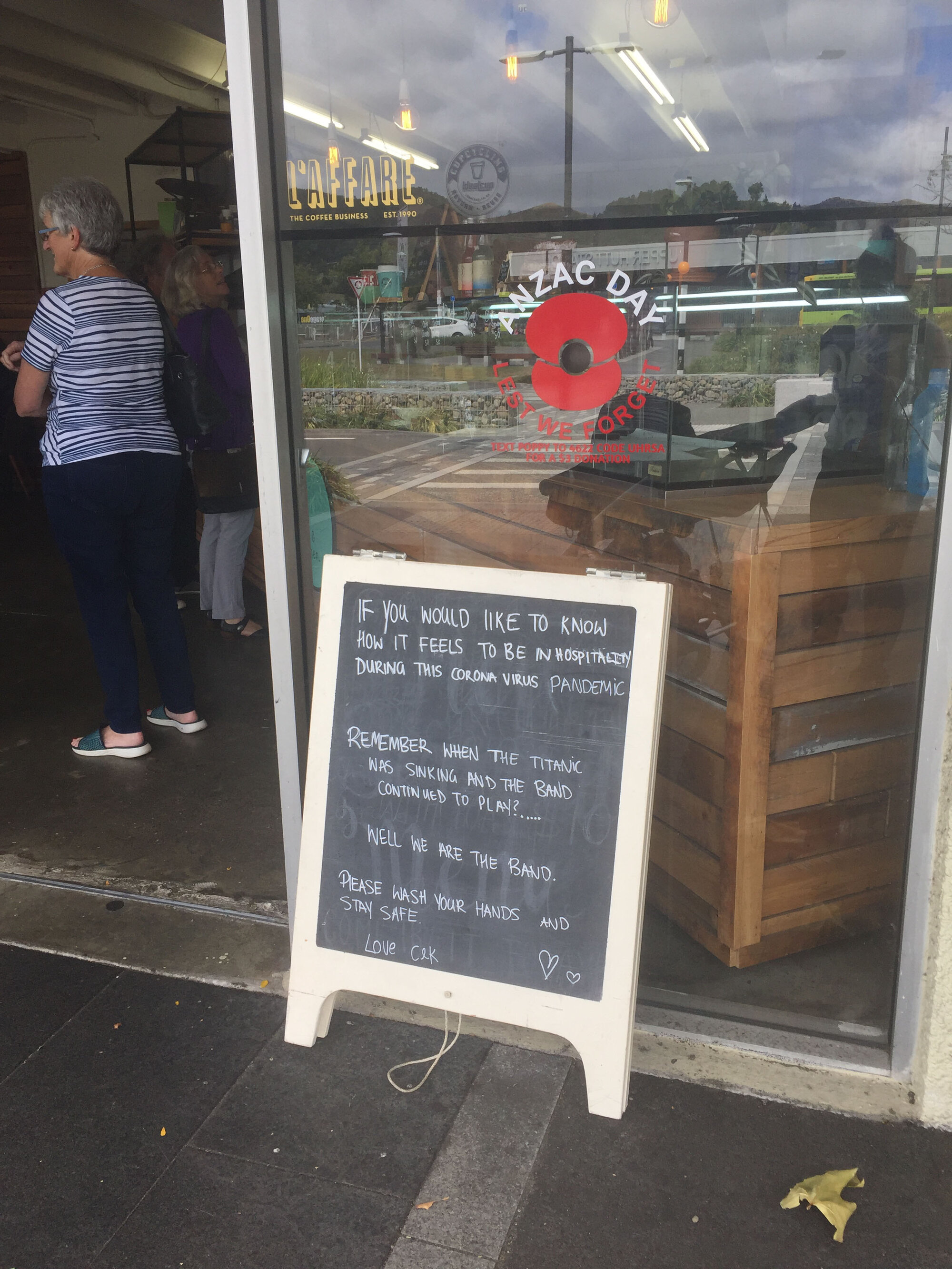 Cake and Kitchen cafe chalkboard coronavirus message
