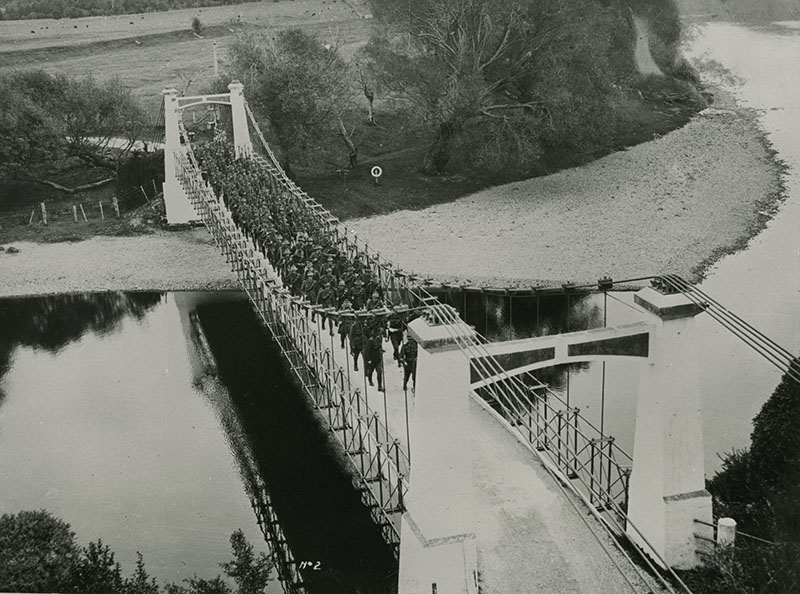 Maoribank suspension bridge; troops crossing.