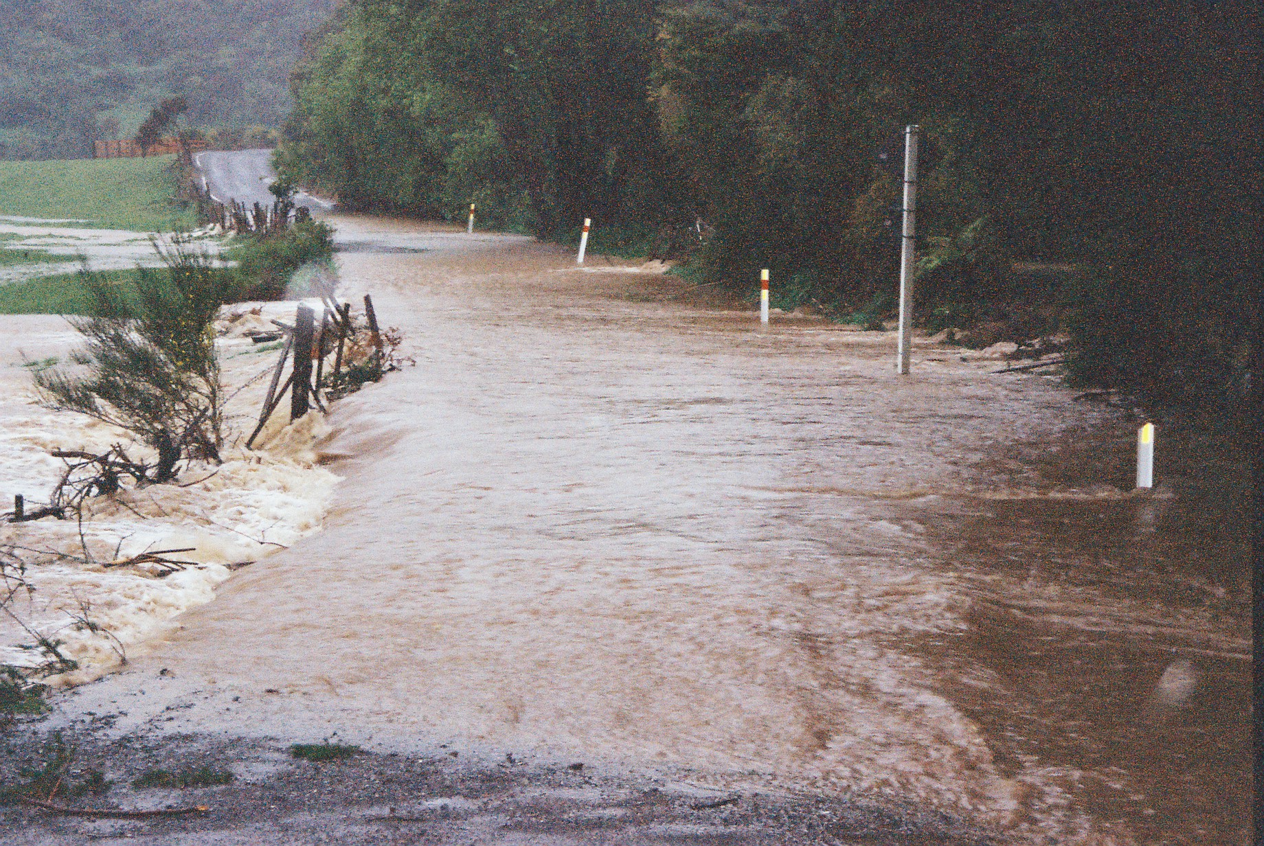 Flood, Karapoti; water crossing the road; seen from the bridge?