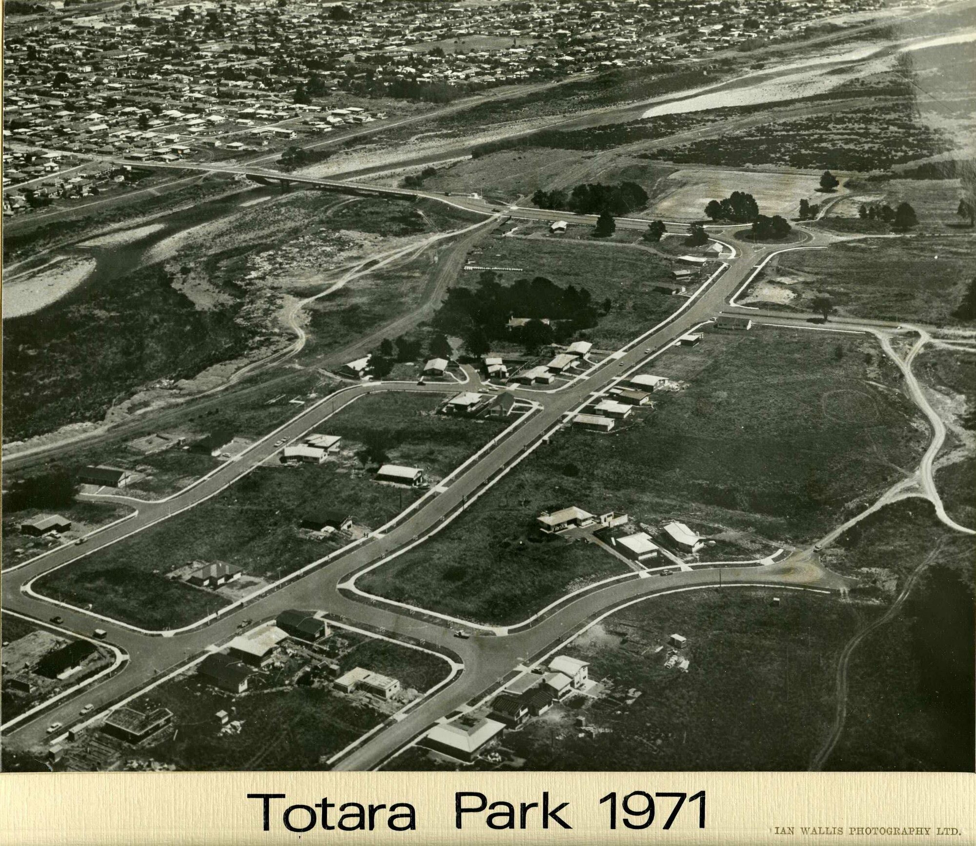 Aerial view, Totara Park, 1971, looking south-west; development progressing; houses in southwest corner.
