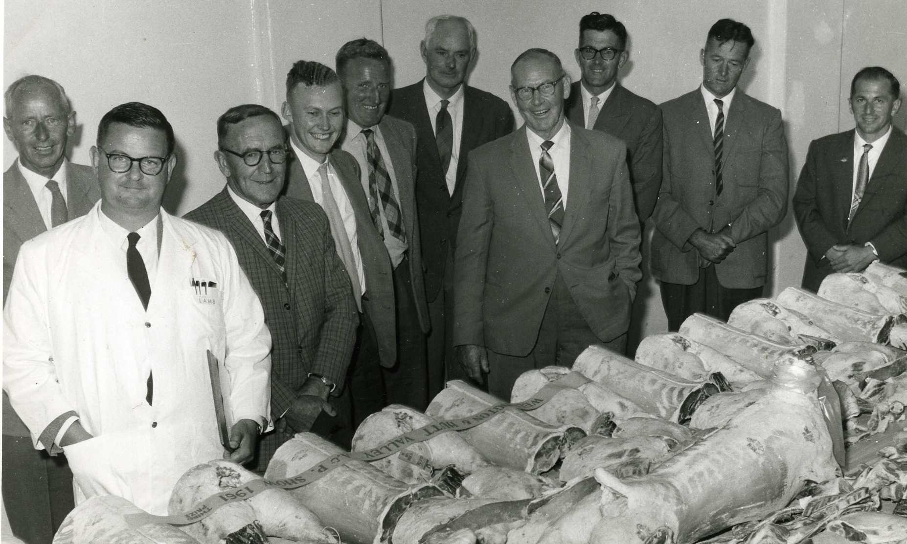 A &amp; P show 1961; joints of meat with third prize banner and panel of judges.