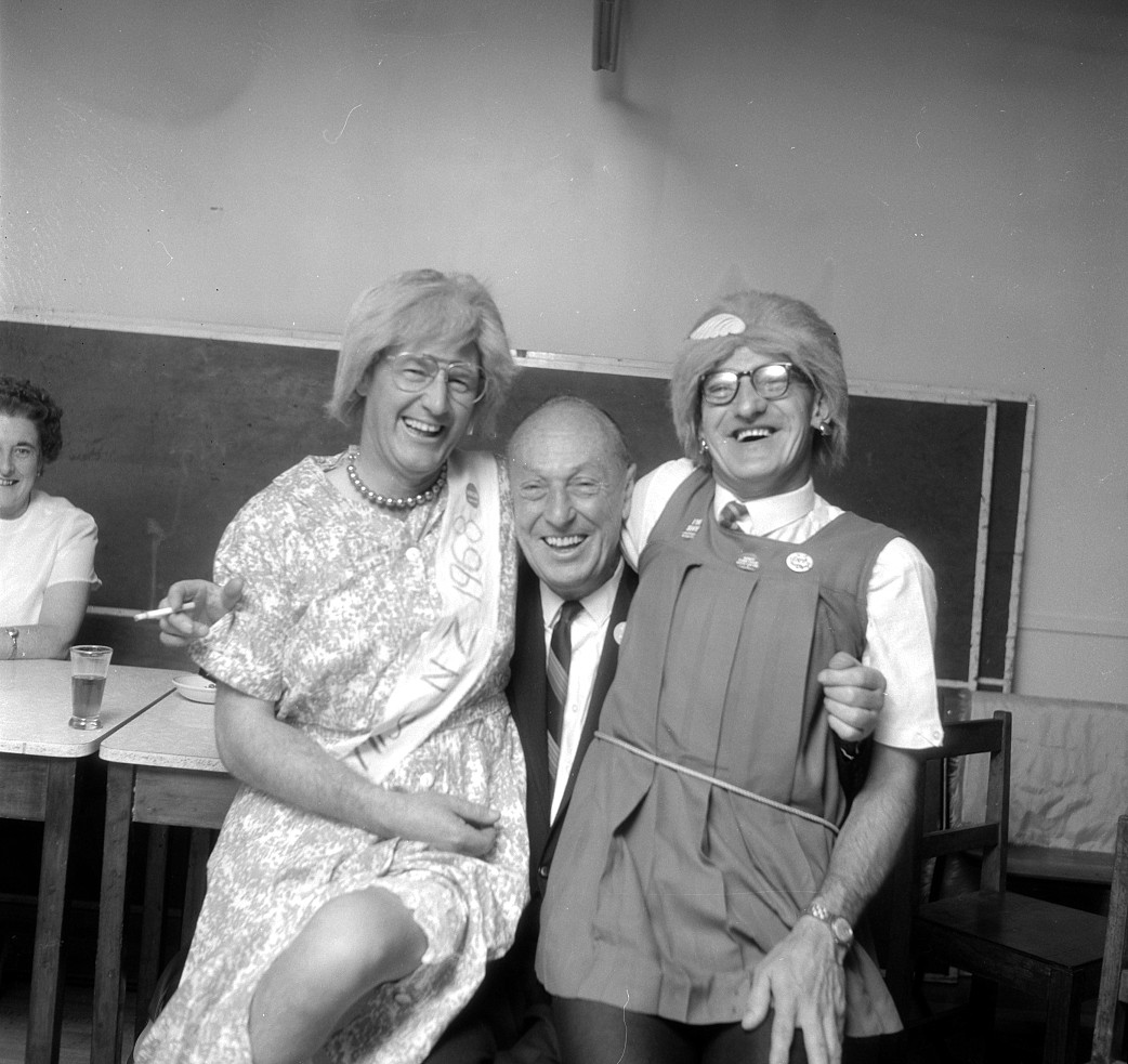 Dunlop Christmas social; George Thomas, central; two 'ladies'.