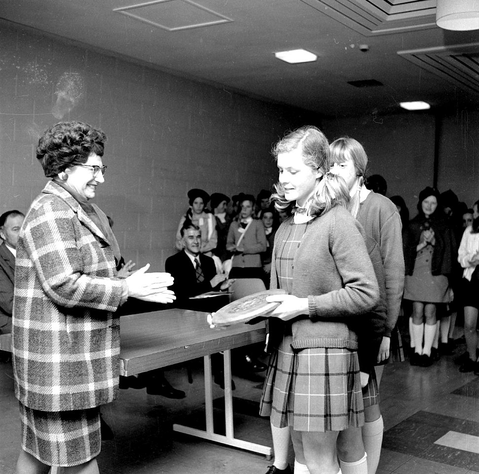 Schoolgirls and mayor Doris Nicholson; Red Cross girls in background; prizegiving. [P1-3381-5771]