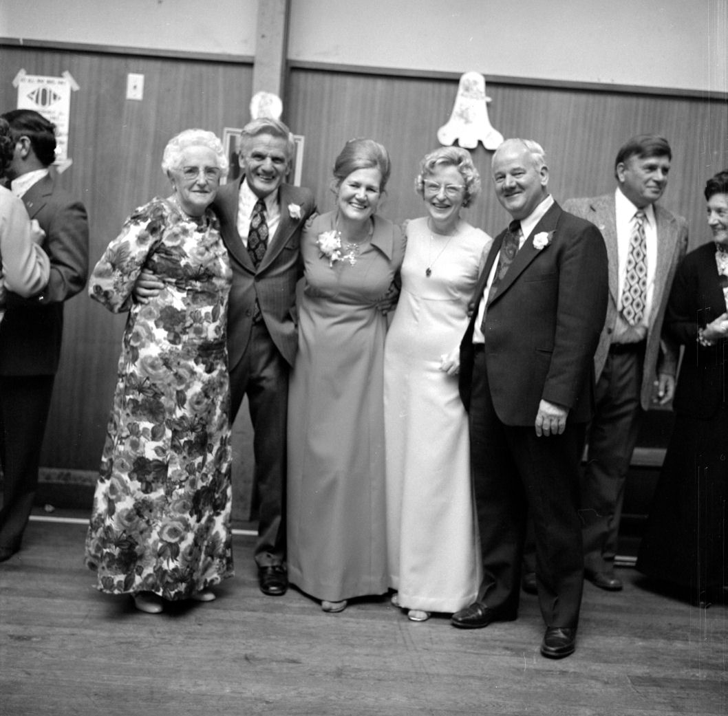 Wallis 25th wedding anniversary  4; couple left of centre. [P1-8829-11219]