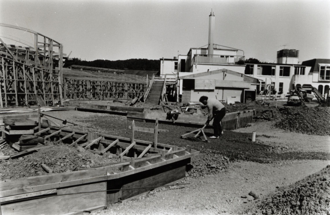 Home of Compassion, Perry Street; new building; Ray Warbrick, Construction Services Co, raking foundation gravel.