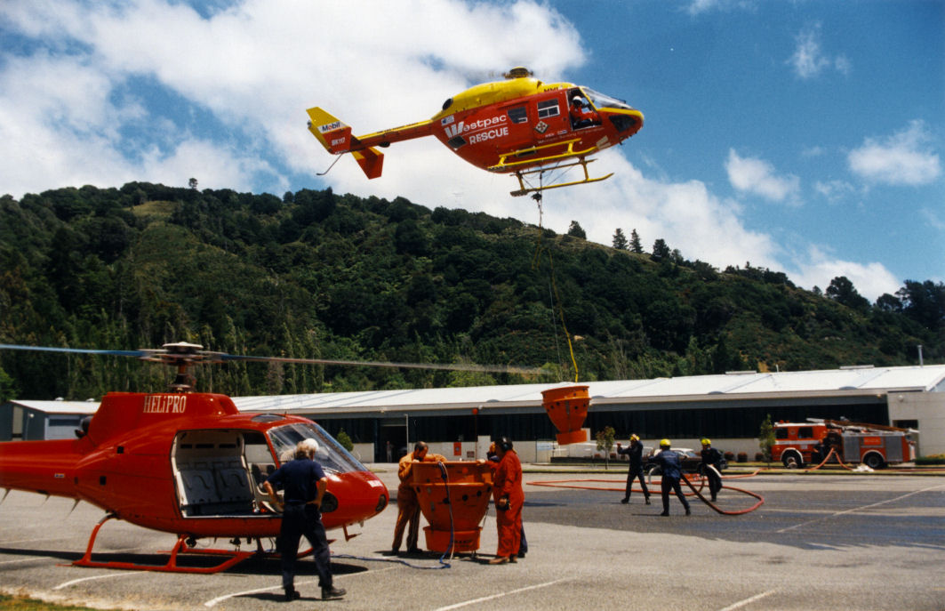 Fire, Wallaceville hill; helicopters refilling monsoon buckets in the Tritec carpark.