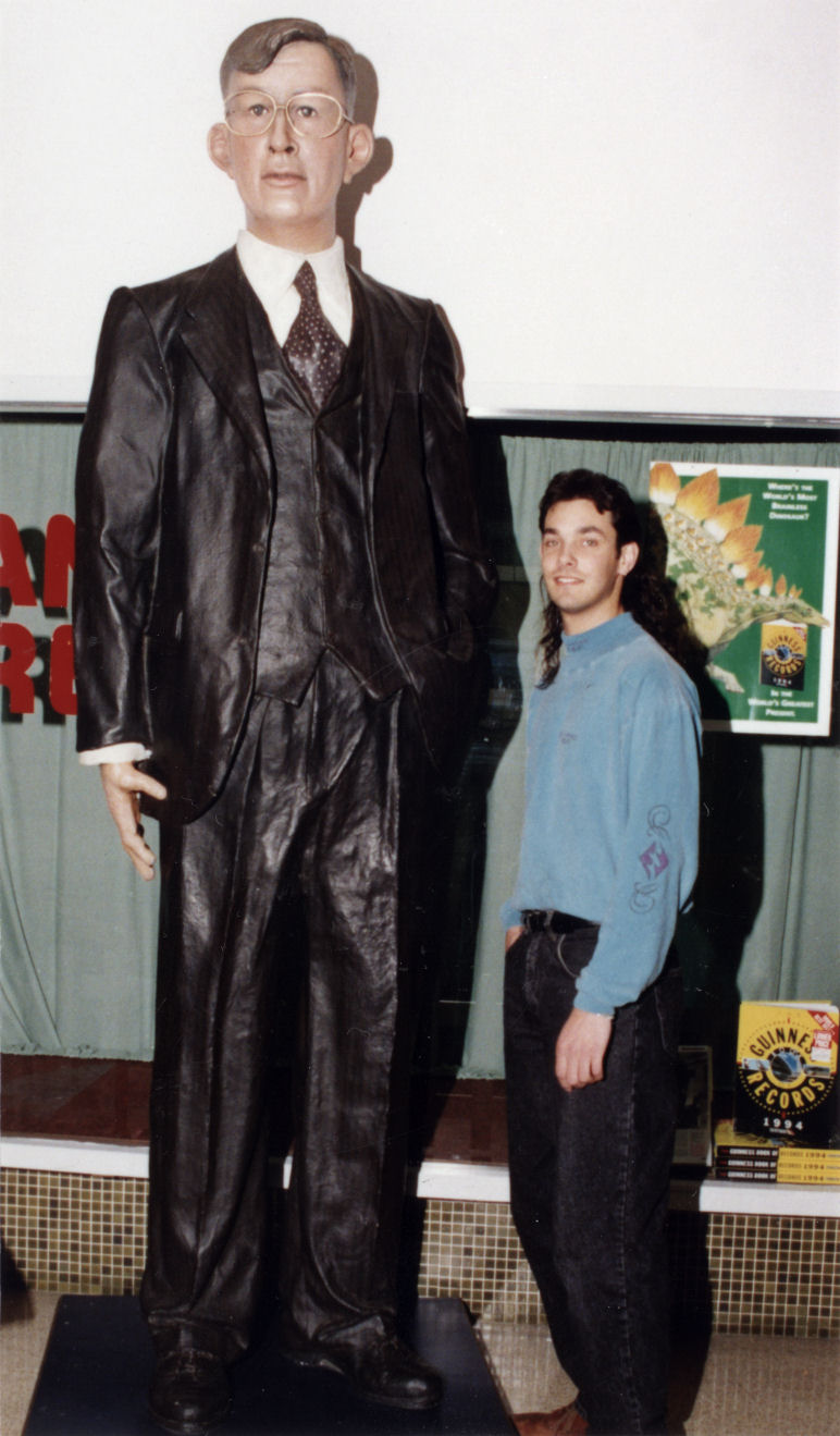 Maidstone Mall; Dominic Wilson, 1.93 metres, alongside figure of the world's tallest man (2.72 m).