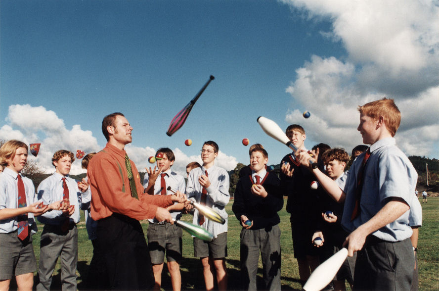 HIBS; jugglers watch teacher Andrew Bowen and Jeremy Harrison passing juggling batons.