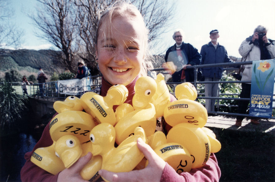 Heretaunga Park; annual duck race; Jennifer Frederickson with an armful.