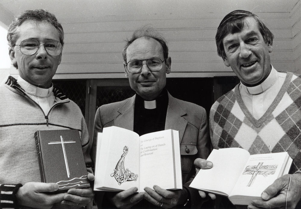 Anglican vicars with the new Prayer Book.