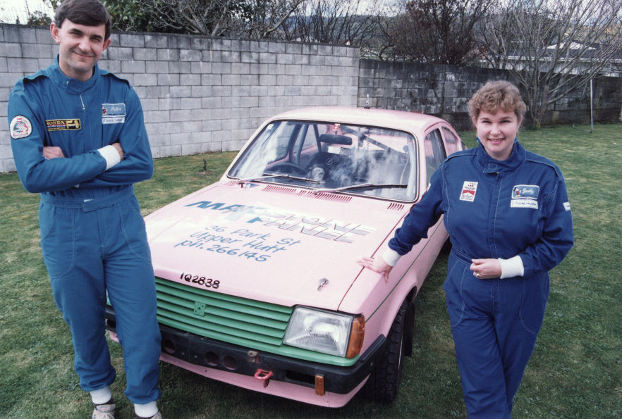 Motor sport; rally couple Peter and Judy Leishman with their pink Isuzu Gemini.]