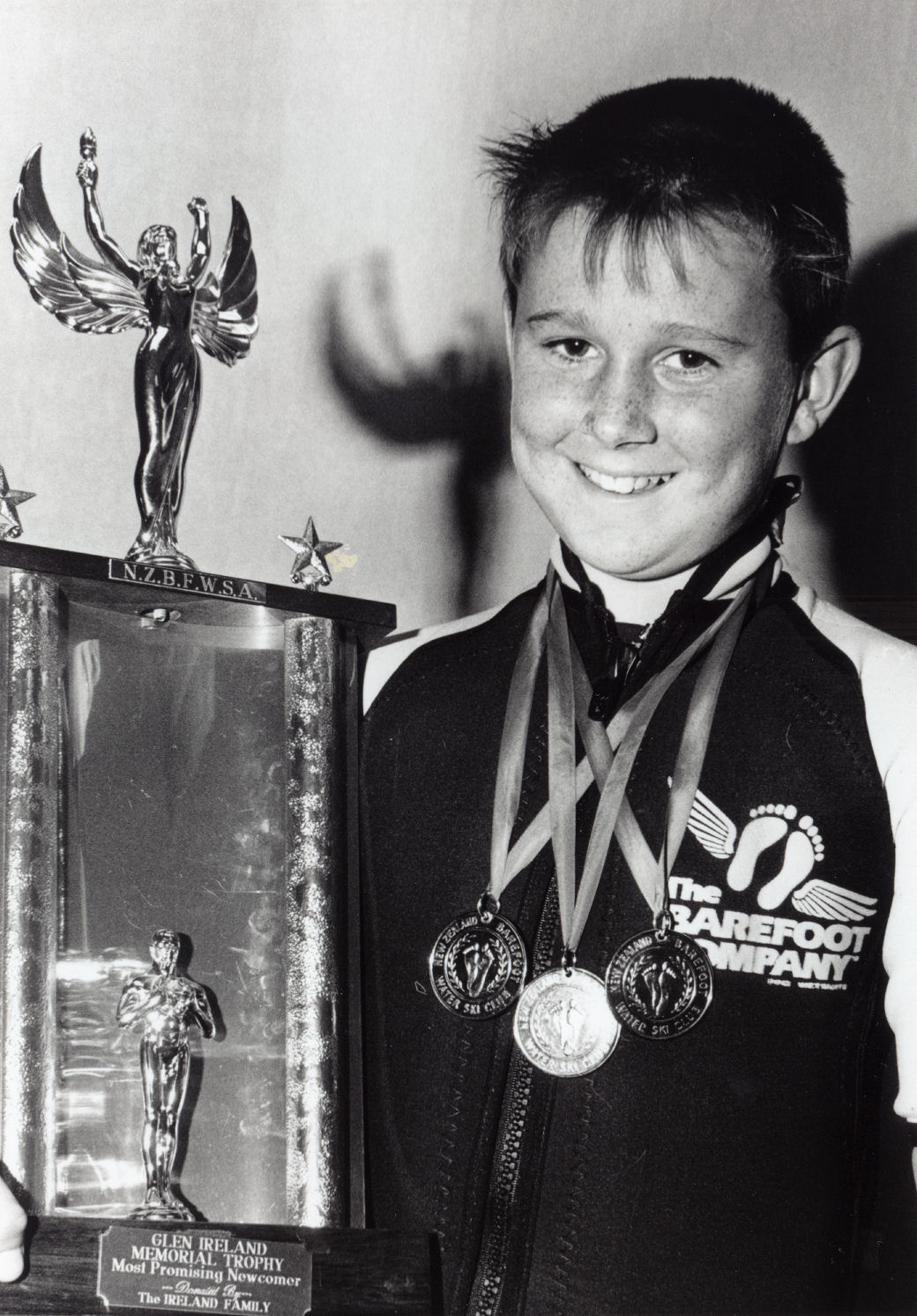 Water skiing; barefoot skier Jason MacArthur with three gold medals and the Glen Ireland memorial trophy.