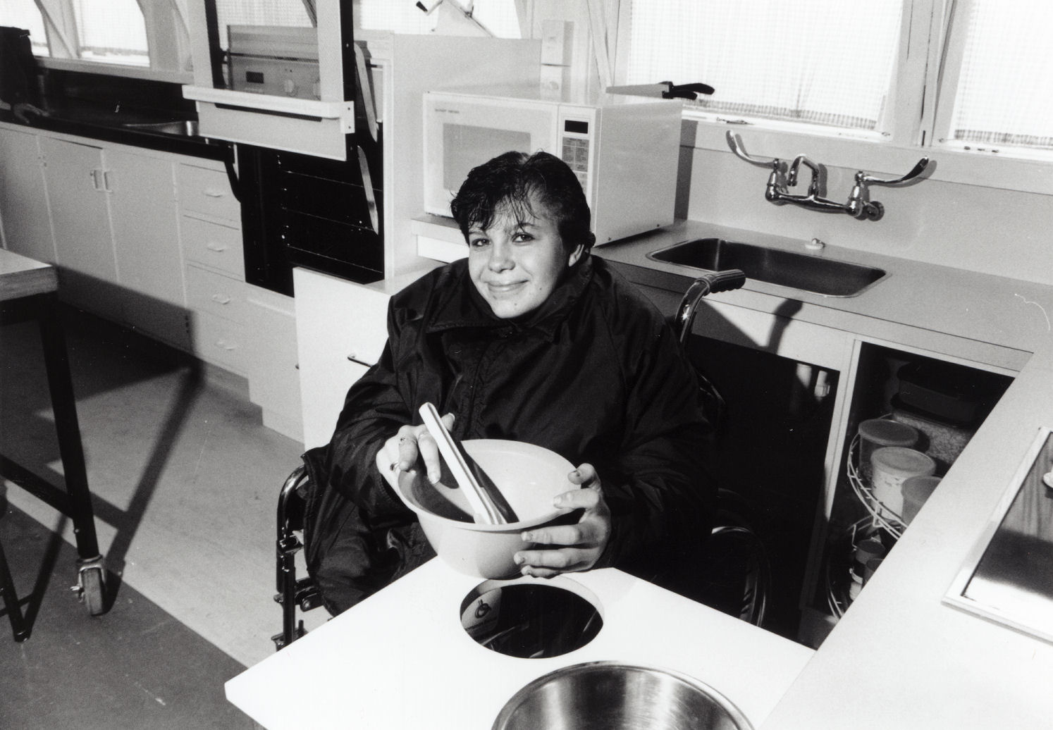 Louise Charles in home economics kitchen for disabled students
