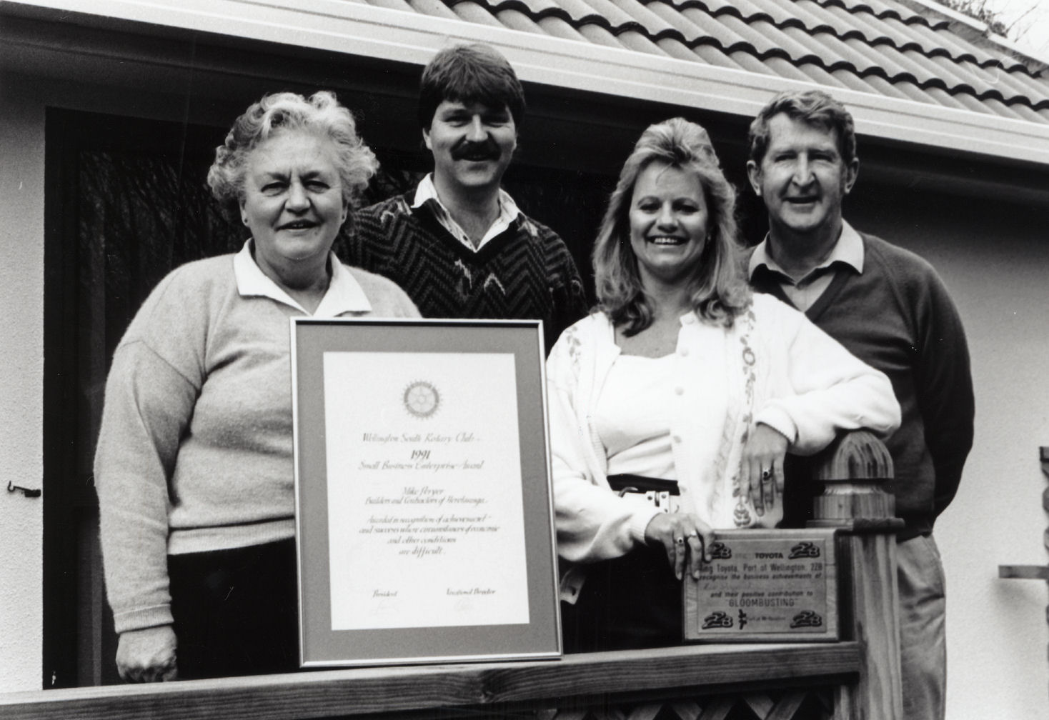 Mike Peryer Builders and Contractors; Moira, Bill, Jan and Mike Peryer with award and plaque.