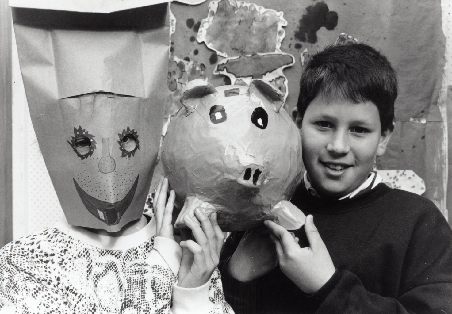 Maoribank School handiwork; Sarah Blake in her mask; Brett Hanrahan with his papier-mache money box.