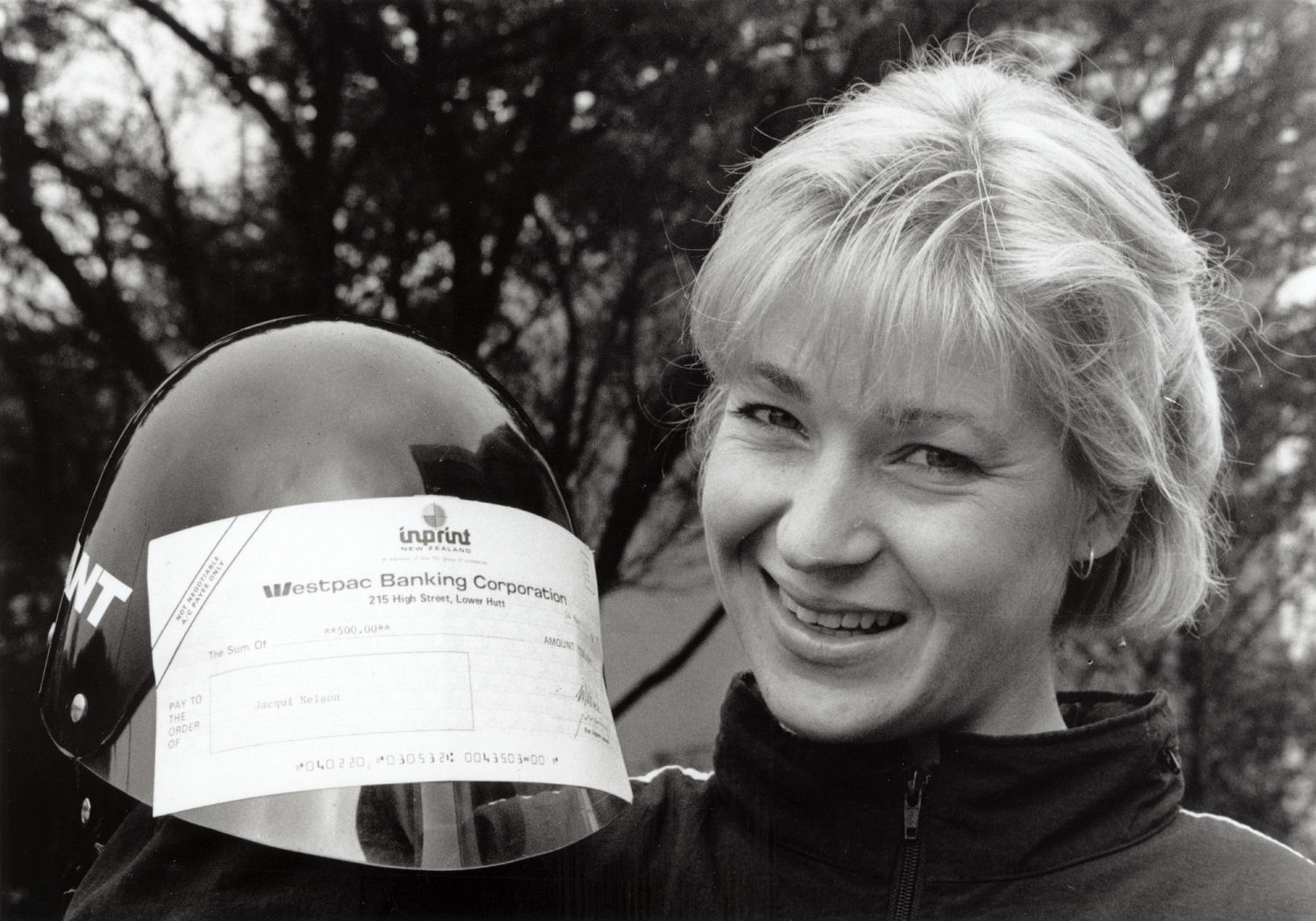 Jacqui Nelson, Olympic cyclist, with $500 cheque presented to her by the Upper Hutt Leader.